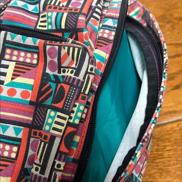 Kavu sling bag backpack in geometric print of Spring Montage.  Good condition. main image 4